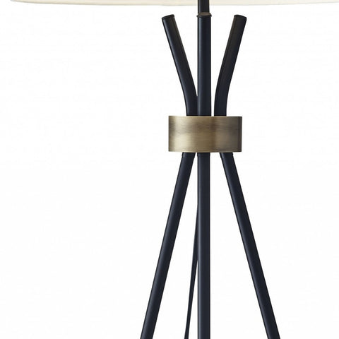 Black Metal Tripod Leg Floor Lamp with Antique Brass Accent