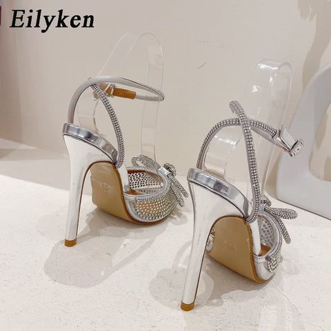 Eilyken New PVC Transparent Women Pumps Sexy Butterfly-knot CRYSTAL High Heels Pointed Toe Wedding Prom Sandals Spring Shoes