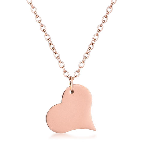 This enchanting necklace features a dainty heart dangling from a cable chain. The pendant and adjustable cable chain are plated in a rose gold